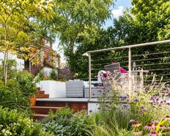 Stainless steel wire balustrade around a planted garden seating terrace